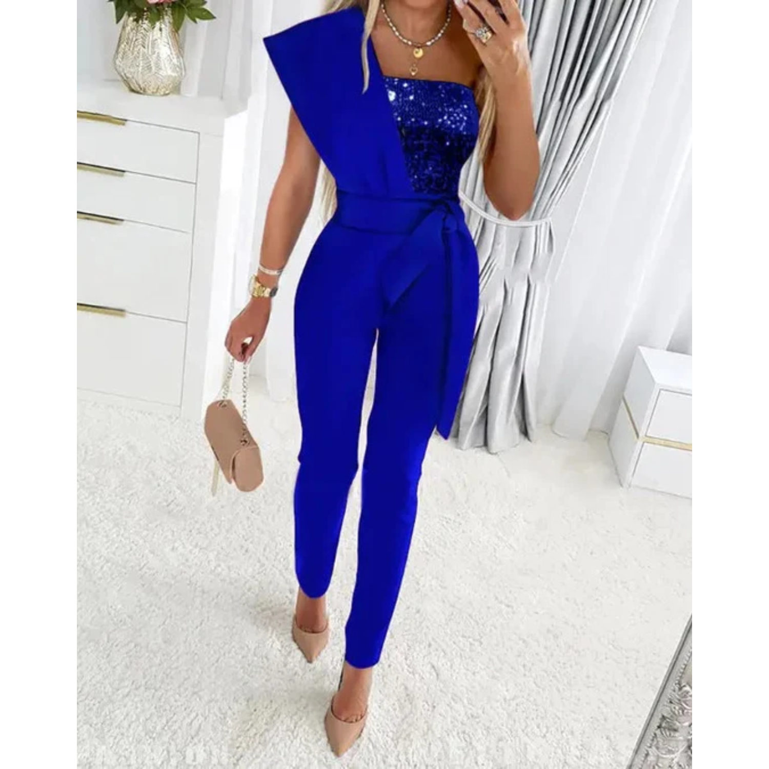 Elegante glitter jumpsuit met strikdetail