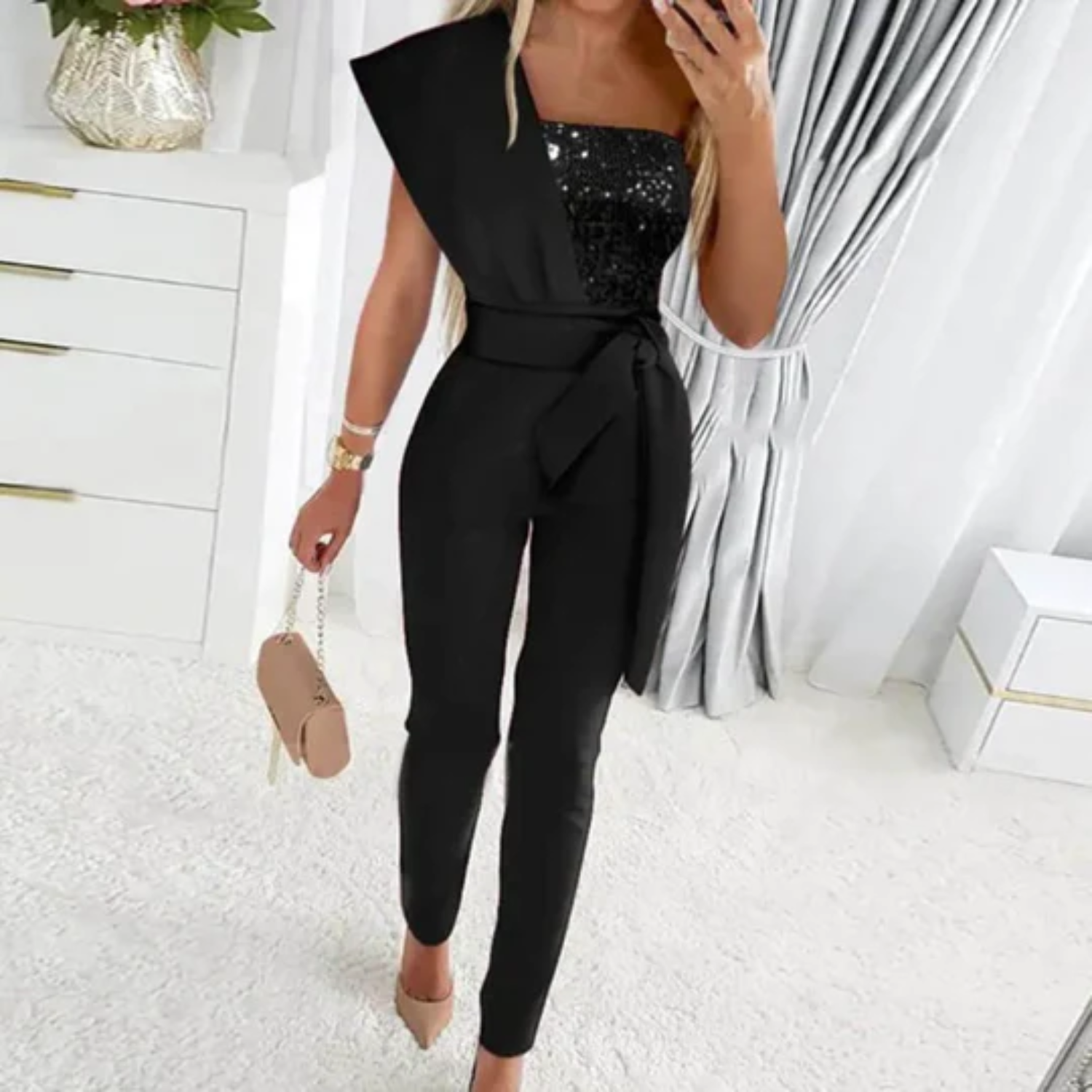 Elegante glitter jumpsuit met strikdetail