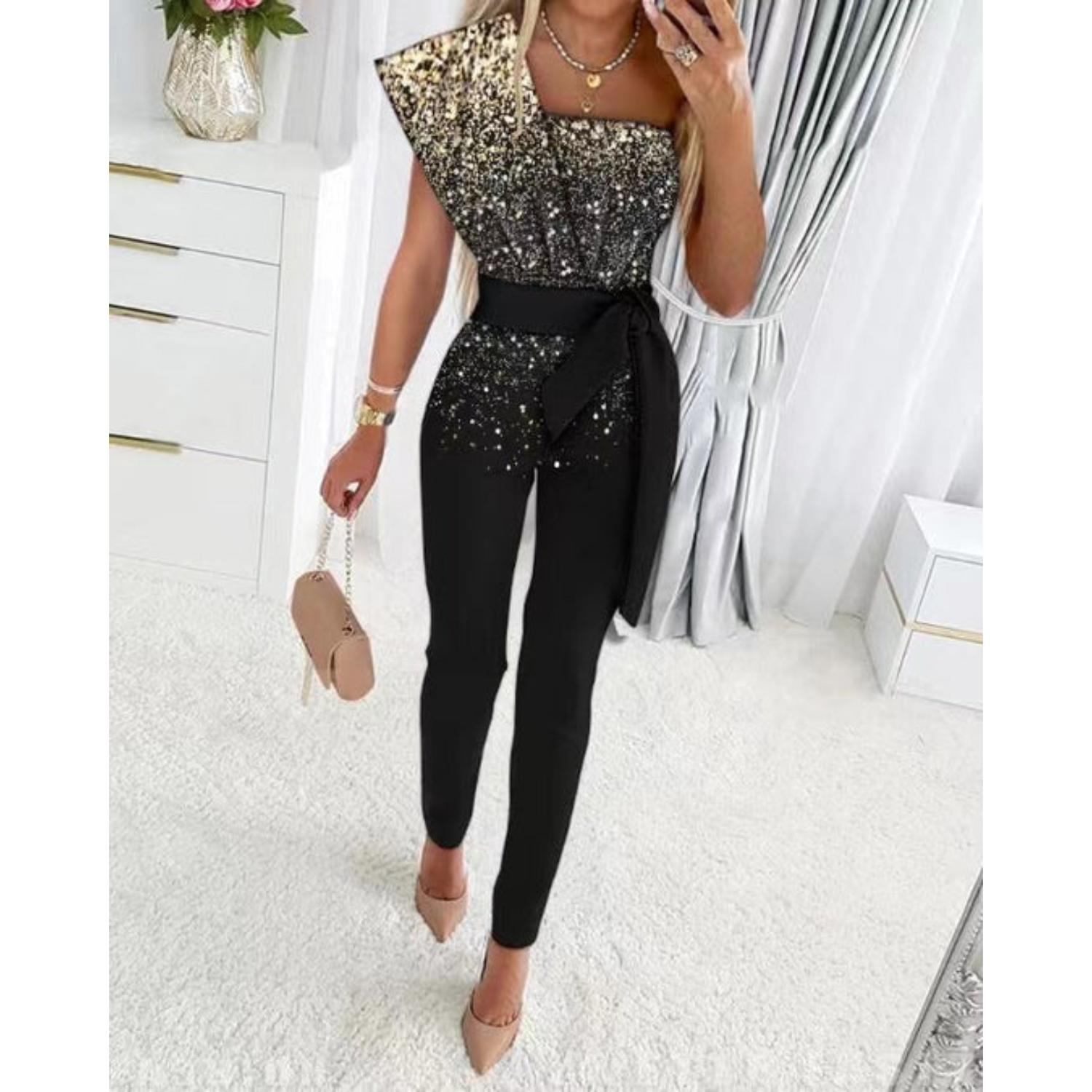 Elegante glitter jumpsuit met strikdetail