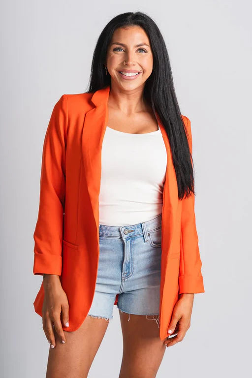 Oranje blazer met manchetten